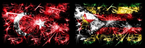 Turkey, Turkish vs Zimbabwe, Zimbabwean New Year celebration sparkling fireworks flags concept background. Combination of two abstract states flags.