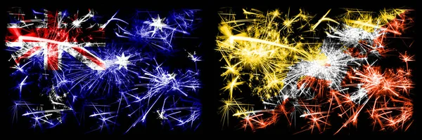 Australia, Ozzie vs Bhutan, Bhutanese New Year celebration sparkling fireworks flags concept background. Combination of two abstract states flags. — Stockfoto