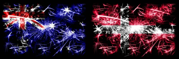 Australien, Ozzie vs Dänemark, dänische Neujahrsfeier funkelnden Feuerwerk Flaggen Konzept Hintergrund. Kombination aus zwei abstrakten Staaten Flaggen. — Stockfoto
