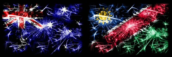 澳大利亚，Ozzie对纳米比亚，纳米比亚新年庆祝闪耀的烟花旗帜概念背景。 两种抽象状态标志的组合. — 图库照片