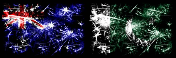 オーストラリア、オジー対パキスタン、パキスタンの新年のお祝い輝く花火の旗のコンセプトの背景。2つの抽象的な状態フラグの組み合わせ. — ストック写真
