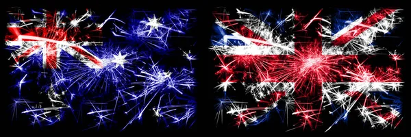 Australia, Ozzie vs United Kingdom, British, Britain New Year celebration sparkling fireworks flags concept background. Combination of two abstract states flags. — Stock Photo, Image