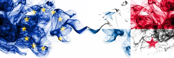 Eu, Europese Unie vs Panama rokerige mystieke vlaggen naast elkaar geplaatst. Dikke gekleurde zijdeachtige abstracte rookvlaggen combinatie — Stockfoto
