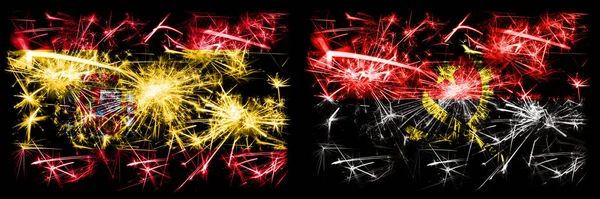 Spanish vs Angola, Angolan New Year celebration sparkling fireworks flags concept background. Combination of two abstract states flags.