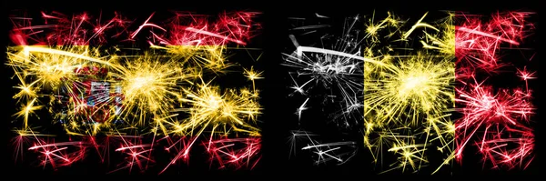 Spaans versus België, Belgisch Nieuwjaar viering sprankelend vuurwerk vlaggen concept achtergrond. Combinatie van twee abstracte vlaggen. — Stockfoto