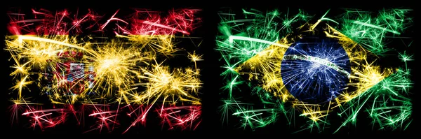 Španělsko vs Brazílie, brazilský Nový rok oslavy jiskřivé ohňostroje vlajky koncept pozadí. Kombinace dvou abstraktních stavových příznaků. — Stock fotografie