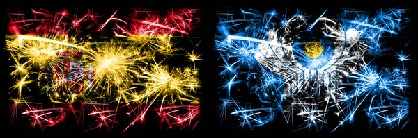 Español vs Commonwealth celebración de Año Nuevo brillante banderas de fuegos artificiales concepto de fondo. Combinación de dos banderas de estados abstractos . —  Fotos de Stock