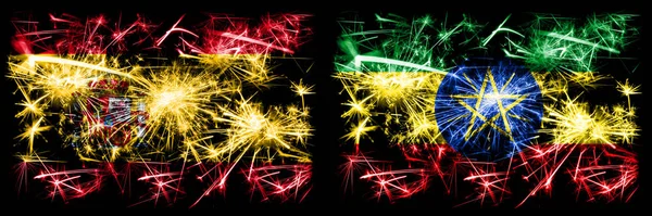 Španělština vs Etiopie, etiopské silvestrovské oslavy jiskřící ohňostroje vlajky koncept pozadí. Kombinace dvou abstraktních stavových příznaků. — Stock fotografie