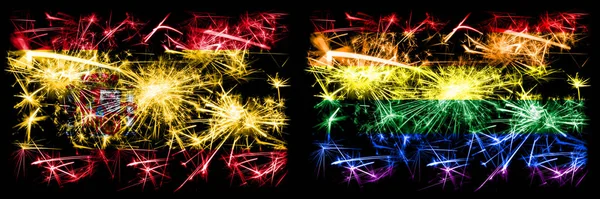 Іспанці проти гей-гордості Новий рік святкують ігристі феєрверки, які відзначають концепт-фон. Комбінація двох абстрактних держав прапори. — стокове фото