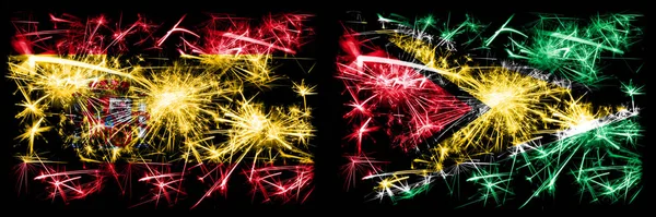 Spanisch vs Guyana, guyanische Neujahrsfeier funkelnden Feuerwerk Flaggen Konzept Hintergrund. Kombination aus zwei abstrakten Staaten Flaggen. — Stockfoto
