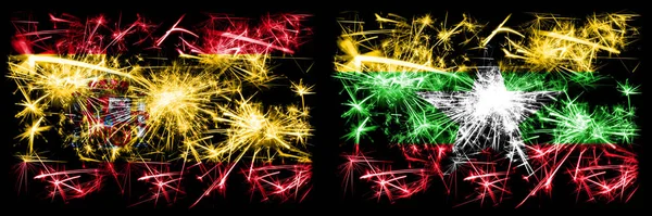 Spanisch vs myanmar Neujahrsfeier funkelnden Feuerwerk Flaggen Konzept Hintergrund. Kombination aus zwei abstrakten Staaten Flaggen. — Stockfoto