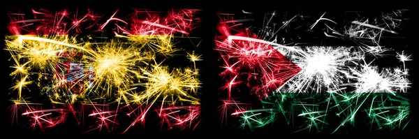 스페인 vs 팔레스타인, 팔레스타인 새해 축하 폭죽 컨셉트 배경. 두 개의 추상 국가가 결합 된 깃발. — 스톡 사진