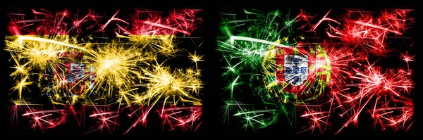 Španělsko vs Portugalsko, Portugalský Nový rok oslavy šumivé ohňostroje vlajky koncept pozadí. Kombinace dvou abstraktních stavových příznaků. — Stock fotografie