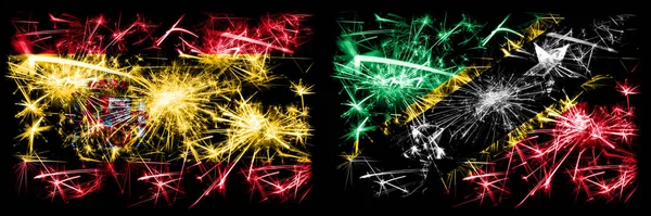 Spanisch vs Saint Kitts und nevis Neujahrsfeier funkelnden Feuerwerk Flaggen Konzept Hintergrund. Kombination aus zwei abstrakten Staaten Flaggen. — Stockfoto