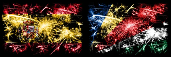 Spanish vs Seychelles, Seychelloise New Year celebration sparkling fireworks flags concept background. Combination of two abstract states flags. — Stock Photo, Image