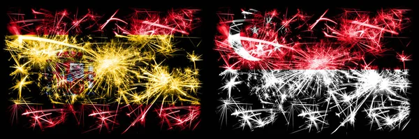 스페인 vs 싱가포르, 싱가포르, 싱가포르 신년 기념행사 번쩍 이는 불꽃놀이 깃발 컨셉트 배경. 두 개의 추상 국가가 결합 된 깃발. — 스톡 사진