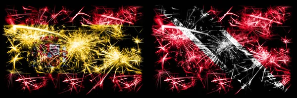 Español vs Trinidad y Tobago Año Nuevo celebración brillante banderas de fuegos artificiales concepto de fondo. Combinación de dos banderas de estados abstractos . —  Fotos de Stock