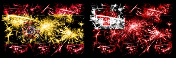 Španělština vs Tonga, Tongan Nový rok oslavy jiskřivé ohňostroje vlajky koncept pozadí. Kombinace dvou abstraktních stavových příznaků. — Stock fotografie