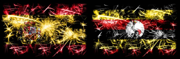 Española vs Uganda, celebración del Año Nuevo ugandés con brillantes banderas de fuegos artificiales fondo concepto. Combinación de dos banderas de estados abstractos . —  Fotos de Stock
