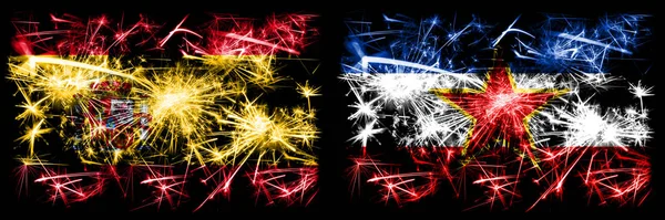 スペイン対ユーゴスラビア、ユーゴスラビアの新年のお祝い輝く花火フラグのコンセプトの背景。2つの抽象的な状態フラグの組み合わせ. — ストック写真