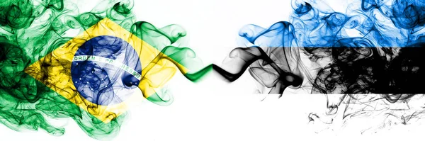 Brazil, Brazilian vs Estonia, Estonian smoky mystic flags placed side by side. Thick colored silky abstract smoke flags combination — Stock Photo, Image