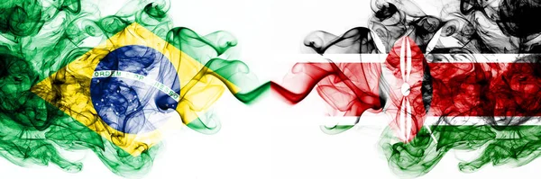 Бразилія, Бразилія проти Кенії, кенійські димові містичні прапори розміщені пліч-о-пліч. Товсті кольорові сріблясті абстрактні димові прапори комбінують — стокове фото