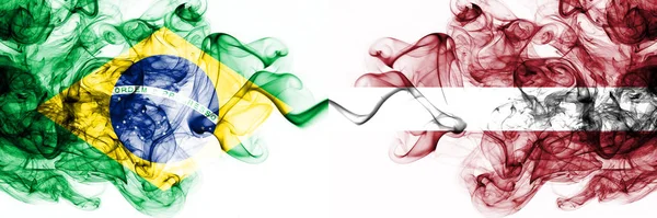 Brazil, Brazilian vs Latvia, Latvian smoky mystic flags placed side by side. Thick colored silky abstract smoke flags combination — Stock Photo, Image