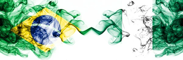 Brazil, Brazilian vs Nigeria, Nigerian smoky mystic flags placed side by side. Thick colored silky abstract smoke flags combination — Stock Photo, Image