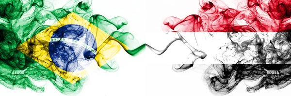 Brazil, Brazilian vs Yemen, Yemeni smoky mystic flags placed side by side. Thick colored silky abstract smoke flags combination — Stock Photo, Image