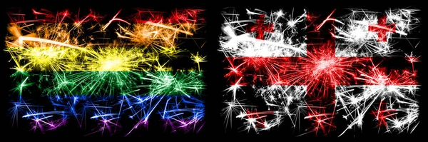 Gay pride vs Georgia, Georgian New Year celebration sparkling fireworks flags concept background. Abstract combination of two flags. — Stock Photo, Image