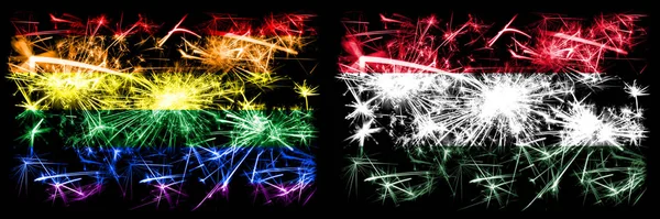 Orgullo gay vs Hungría, celebración del Año Nuevo húngaro brillante banderas de fuegos artificiales concepto de fondo. Combinación abstracta de dos banderas . — Foto de Stock