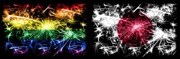 Gay pride vs japan, japanische Neujahrsfeier funkelndes Feuerwerk Flaggen Konzept Hintergrund. abstrakte Kombination zweier Flaggen. — Stockfoto