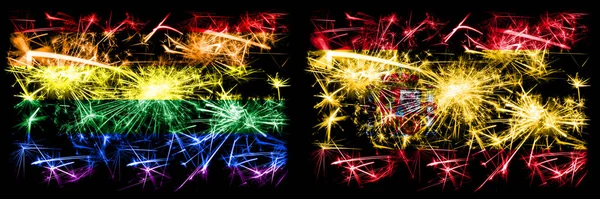 Gej duma vs Hiszpania hiszpański Nowy Rok uroczystości musujące fajerwerki flagi pojęcie tło. Abstrakcyjne połączenie dwóch flag. — Zdjęcie stockowe