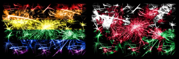Homo trots vs Wales, Welsh Nieuwjaar viering sprankelend vuurwerk vlaggen concept achtergrond. Abstracte combinatie van twee vlaggen. — Stockfoto