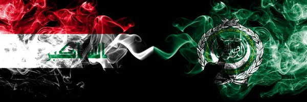 伊拉克 伊拉克与阿拉伯联盟的烟熏神秘旗肩并肩放在一起 浓密的彩色丝质烟旗连在一起 — 图库照片