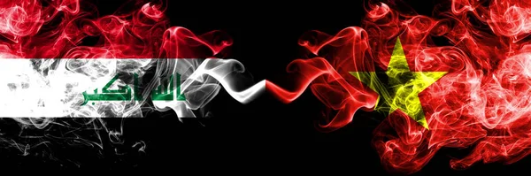 Iraq, Iraqi vs Vietnam, Vietnamese smoky mystic flags placed side by side. Thick colored silky smokes flags together