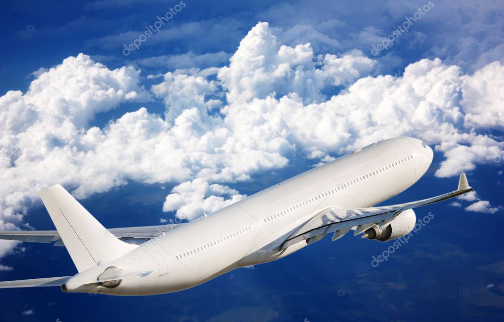 Passenger plane in the sky among the clouds. The concept of holidays and travel. Air transport travel