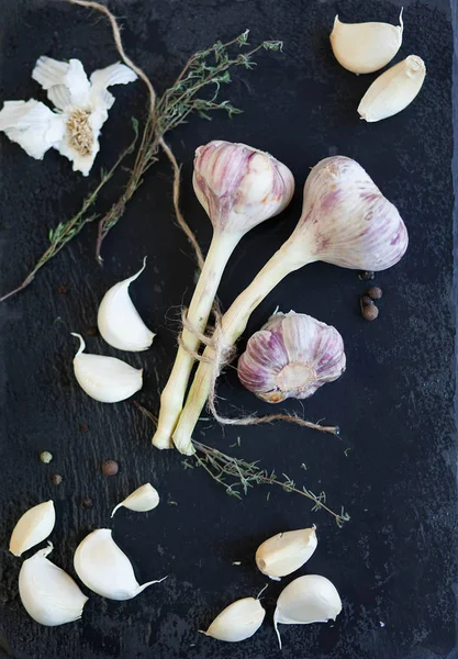 Garlic cloves on black
