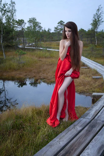 Woman posing in a bog — Stock Photo, Image