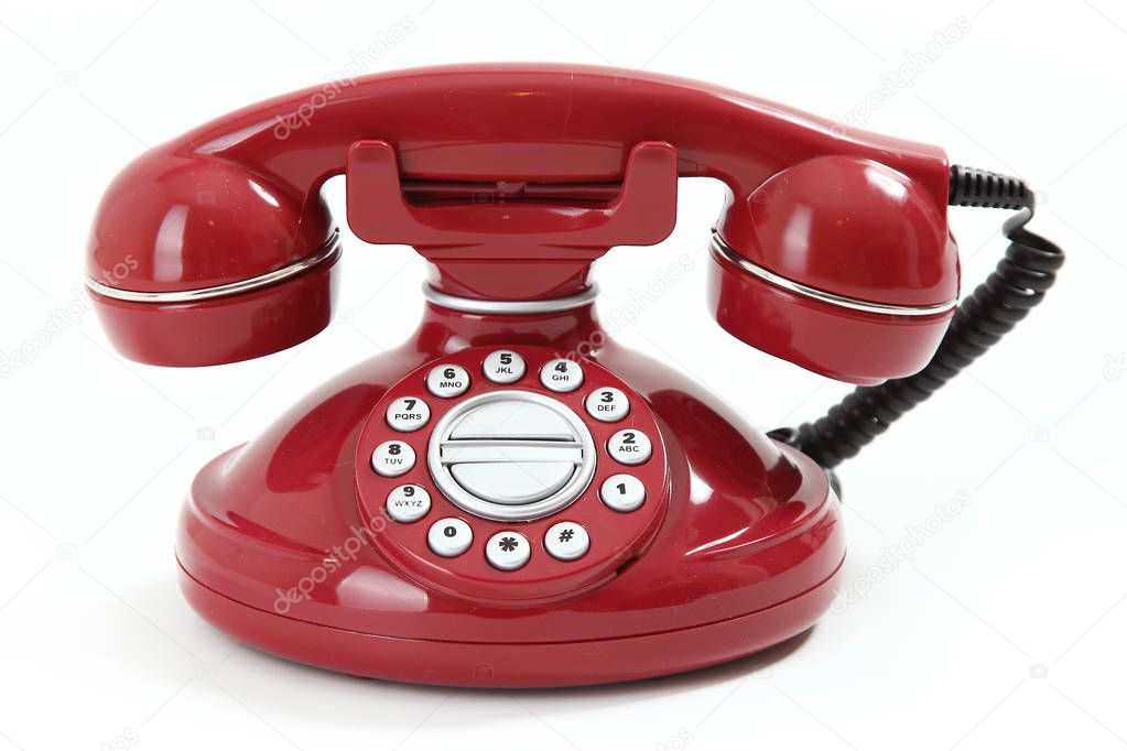 red retro-styled telephone on white background