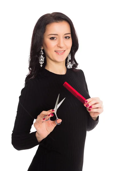 Krásná dívka kadeřnice nůžky a hřeben — Stock fotografie
