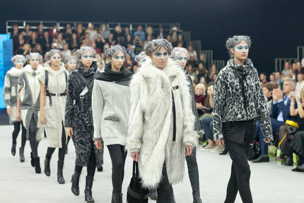 Fashion models wearing clothes designed by Marina Design