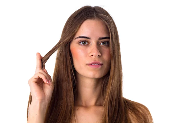 Mujer sosteniendo un mechón de pelo —  Fotos de Stock