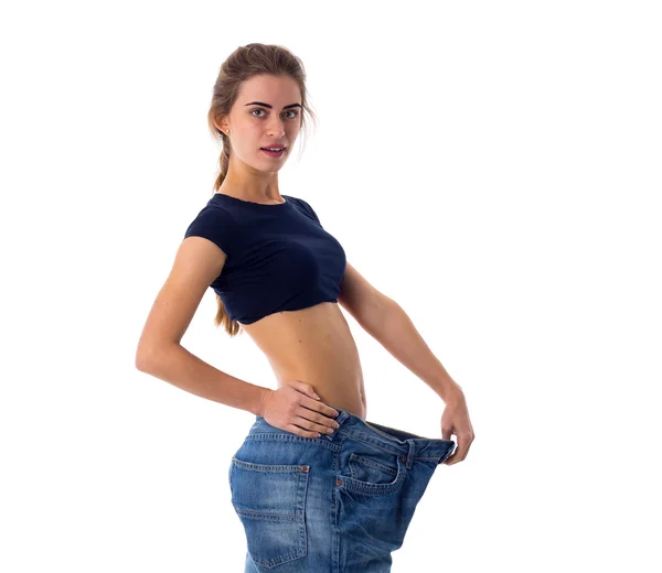 Mujer que usa jeans de tamaño mucho más grande —  Fotos de Stock