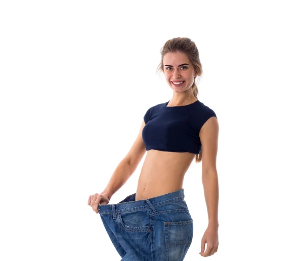 Mujer que usa jeans de tamaño mucho más grande — Foto de Stock