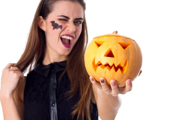 Mujer con banda de mano sosteniendo una calabaza —  Fotos de Stock