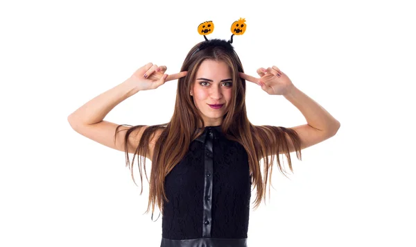 Woman with headband touching her head — Stockfoto