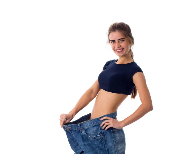 Frau trägt Jeans von viel größerer Größe — Stockfoto