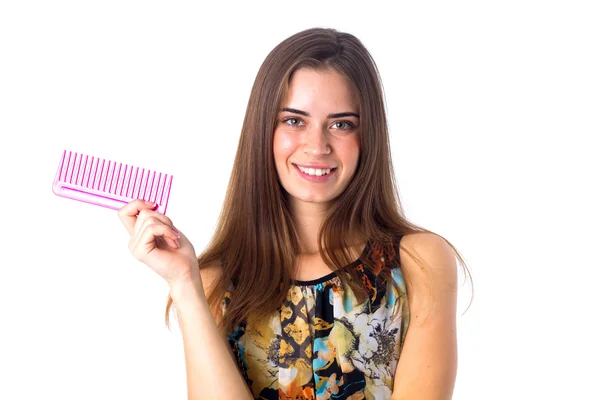 Young woman holding pink hair brush — Stock Photo, Image