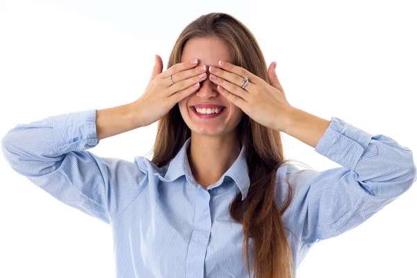 Woman closing eyes by hands — Stockfoto